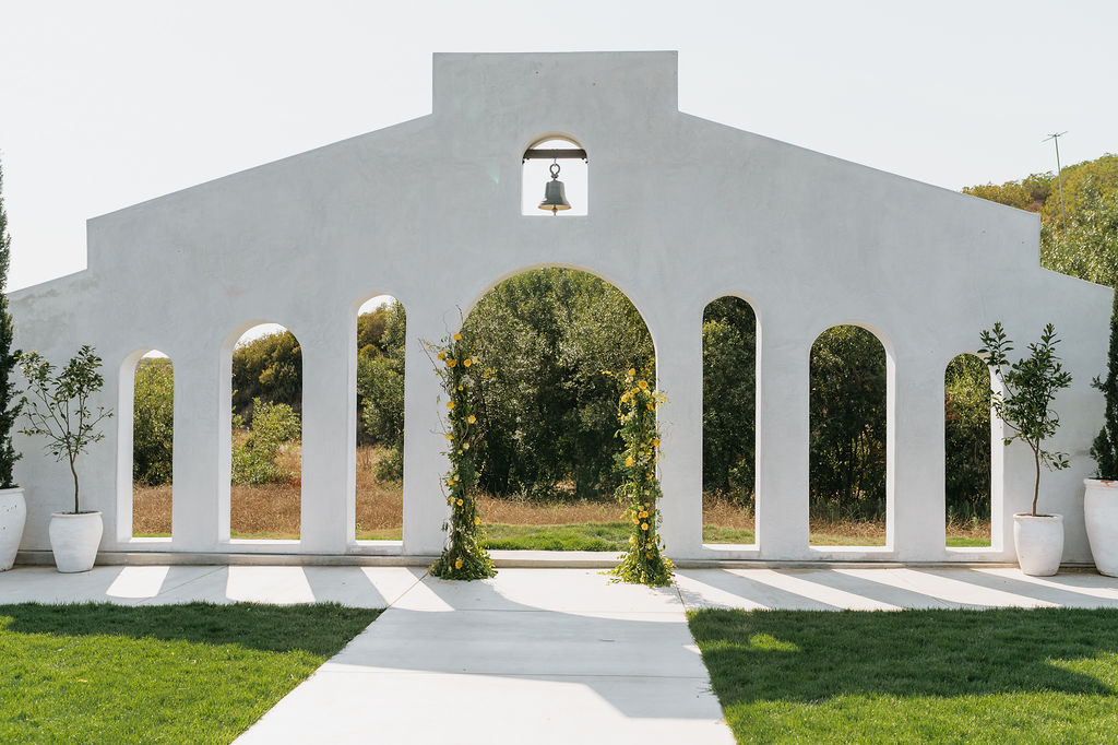 These iconic white arches are the backdrop to the ceremony site at Jeune Perche Wedding Estate.